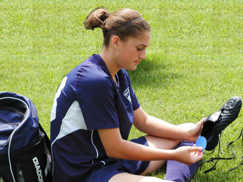 Soccer Player Applying ENGO Blister Patches